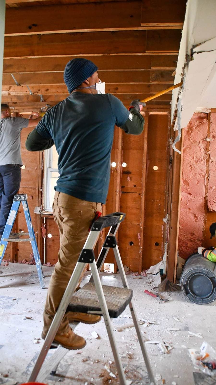 W&K crew stripping walls to the studs during mitigation