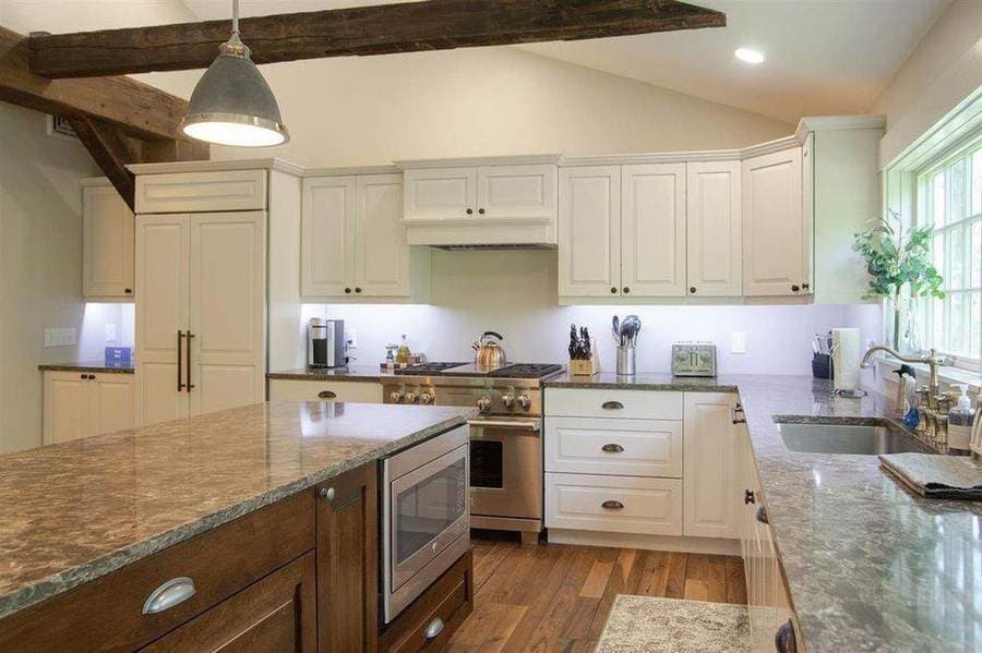 Finished kitchen with exposed beams after W&K reconstruction