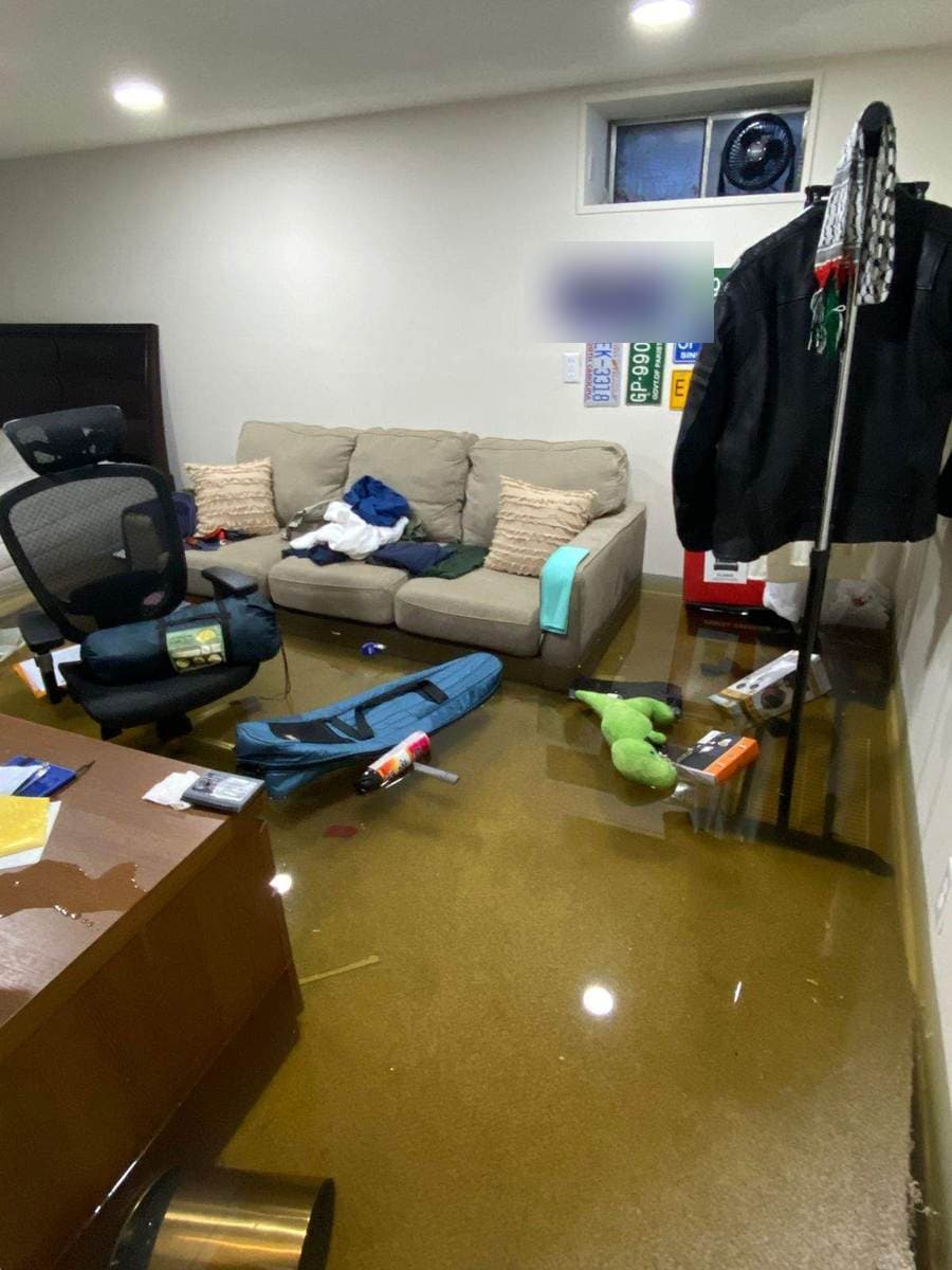 Flooded finished basement with standing water, a Connecticut water loss